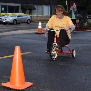 Brandy Roy pedals for the Community Bank N.A. team at the 15th annual Tricycle Race to benefit United Way of the Southern Tier.